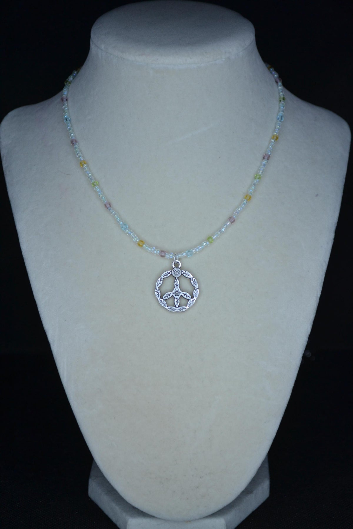 Silver peace sign pendant glass bead choker. Pastel and iridescent crystal