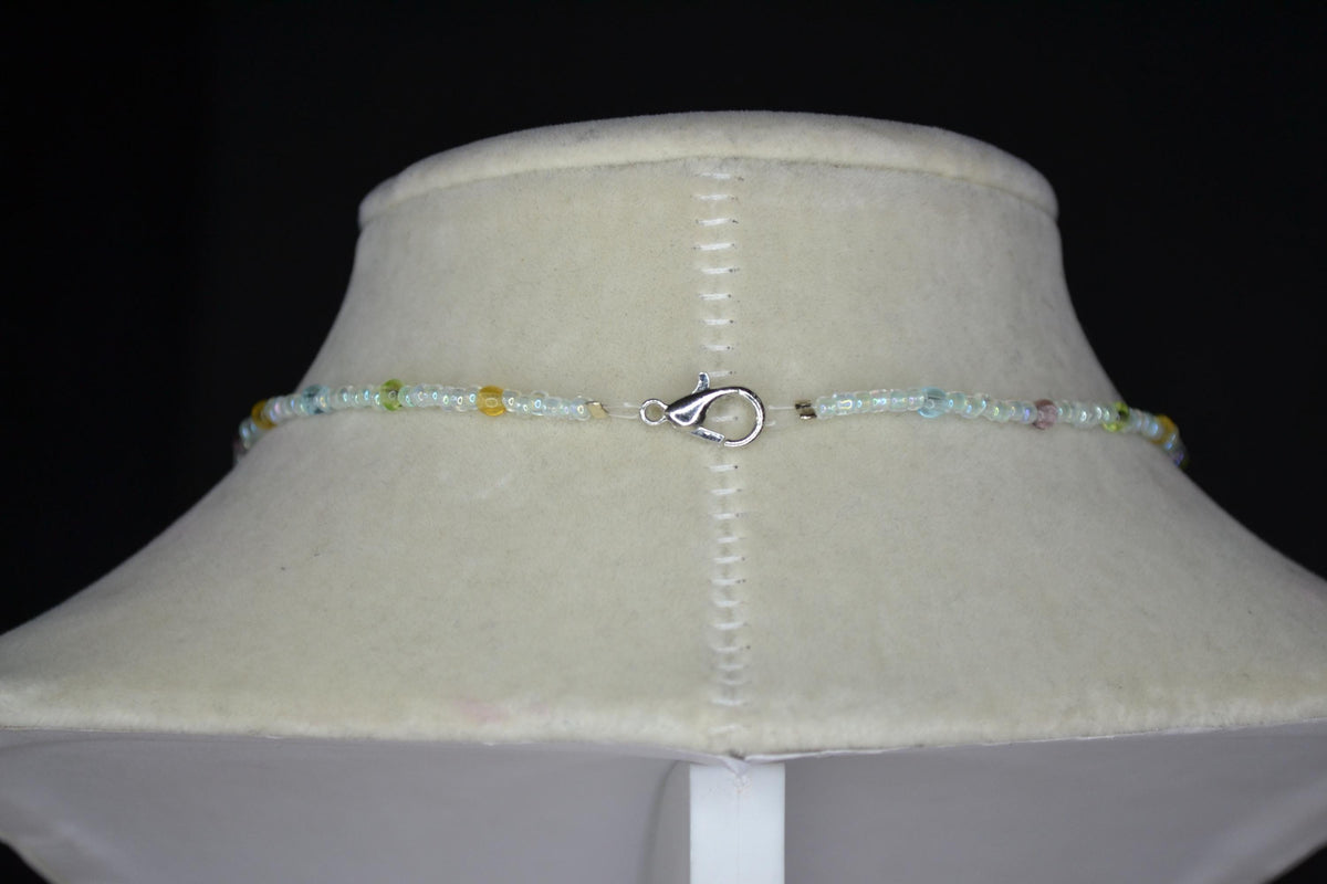 Silver peace sign pendant glass bead choker. Pastel and iridescent crystal
