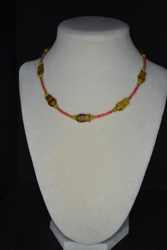 Beaded fish choker. Raspberry, olive, and topaz