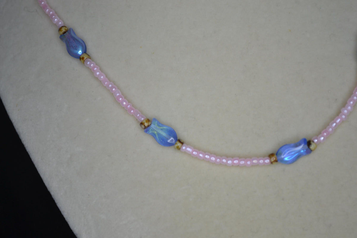 Beaded fish necklace. Pearl pink, iridescent blue, and Picasso