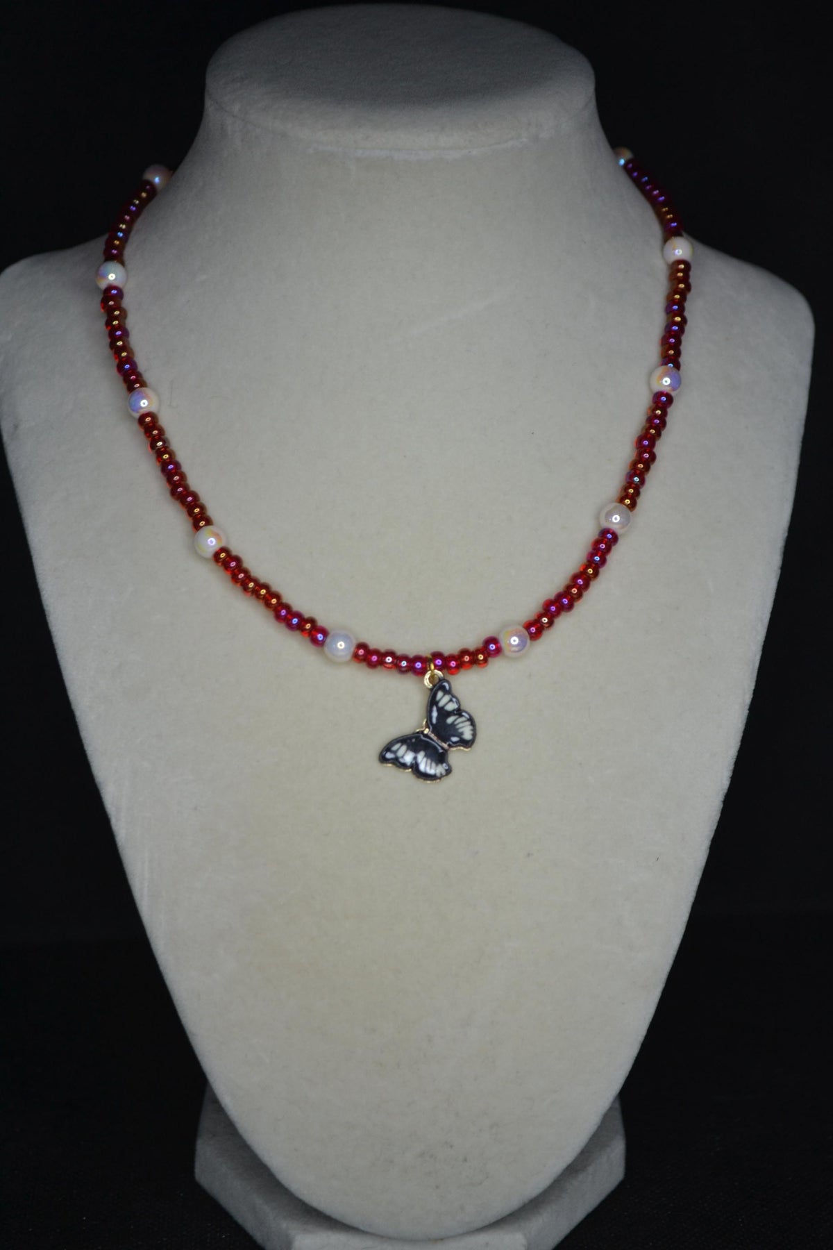 Black Butterfly pendant glass bead necklace. Pearl and red