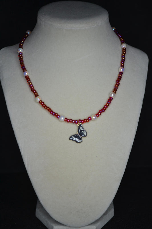 Black Butterfly pendant glass bead necklace. Pearl and red