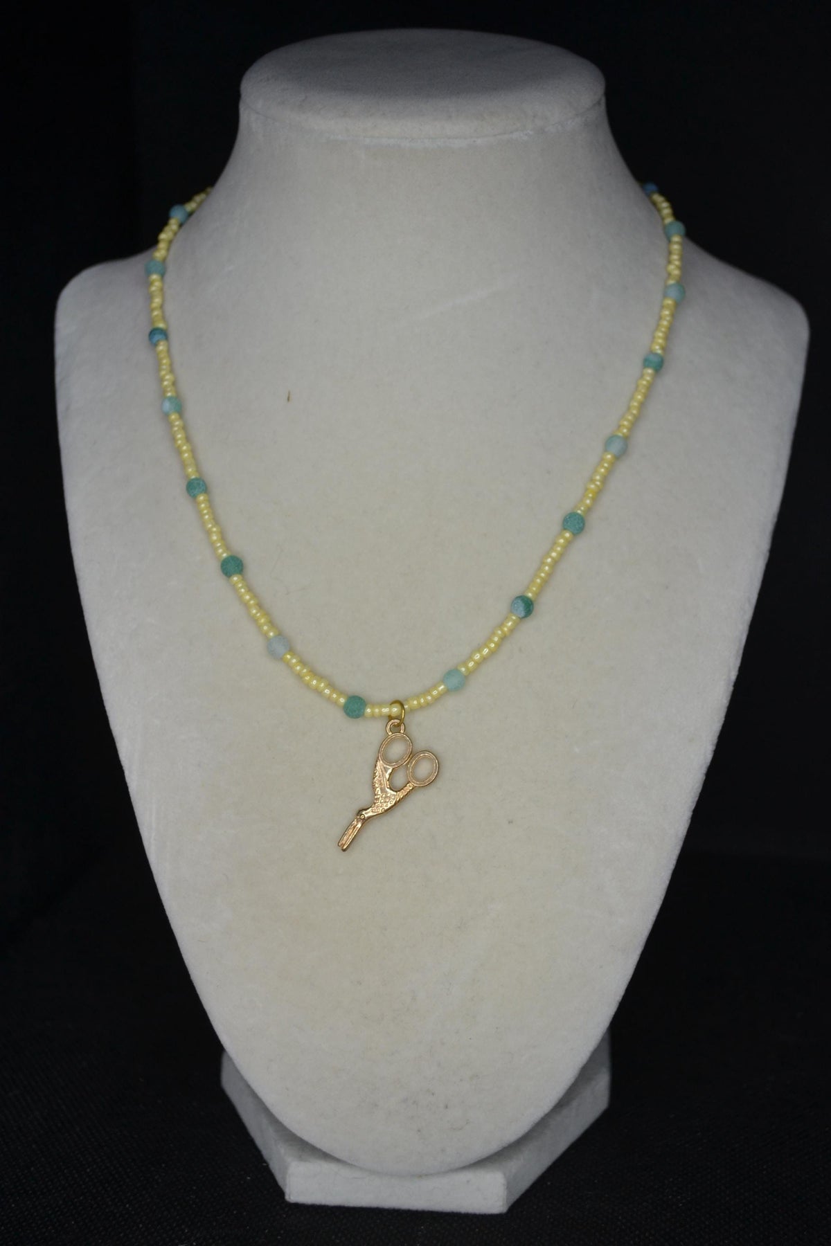 Gold scissor pendant glass bead necklace. Yellow and jade