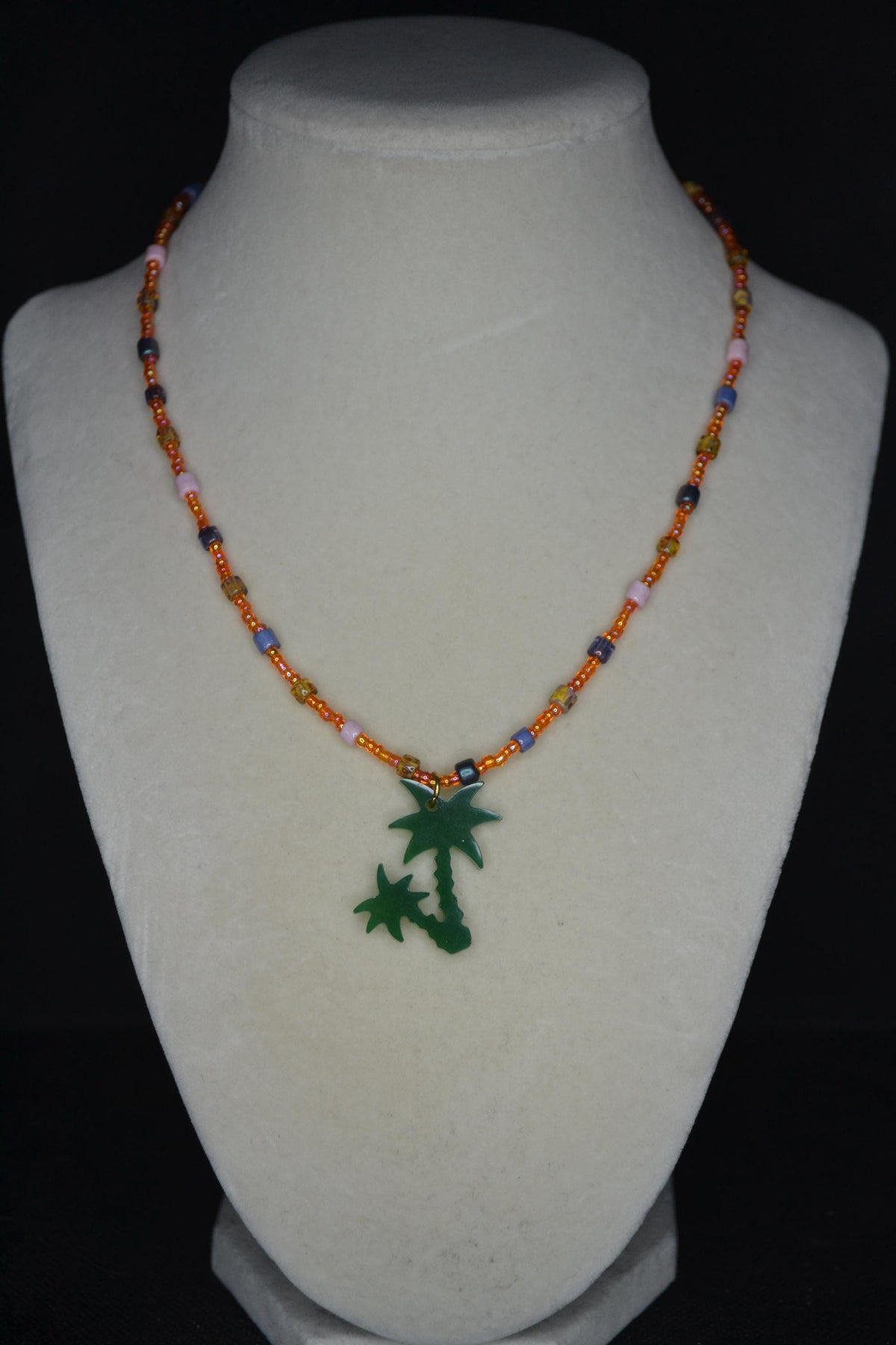 Green Palms pendant glass bead necklace. Orange and Picasso mix