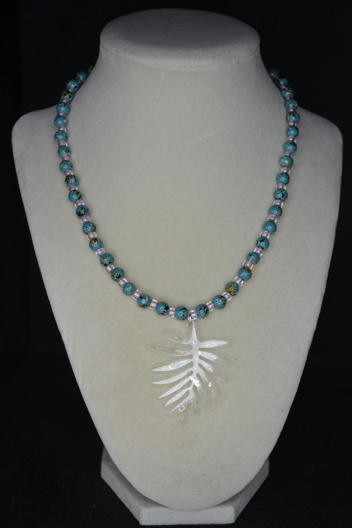Iridescent philodendron pendant glass bead necklace. Turquoise and pink