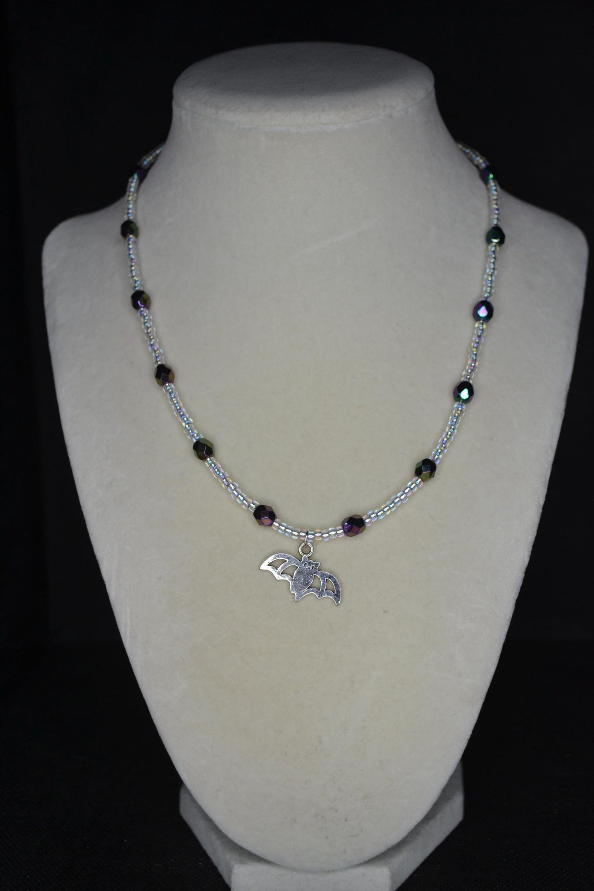 Silver Bat pendant glass bead necklace. Metallic black and crystal