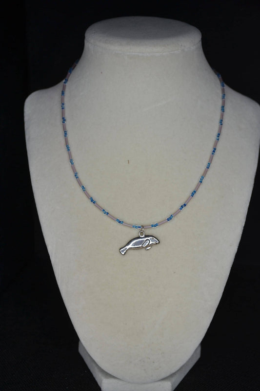Silver Manatee pendant glass bead necklace. Navy and rose