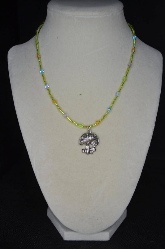 Silver mushroom pendant glass bead necklace. Green, blue, purple, and orange