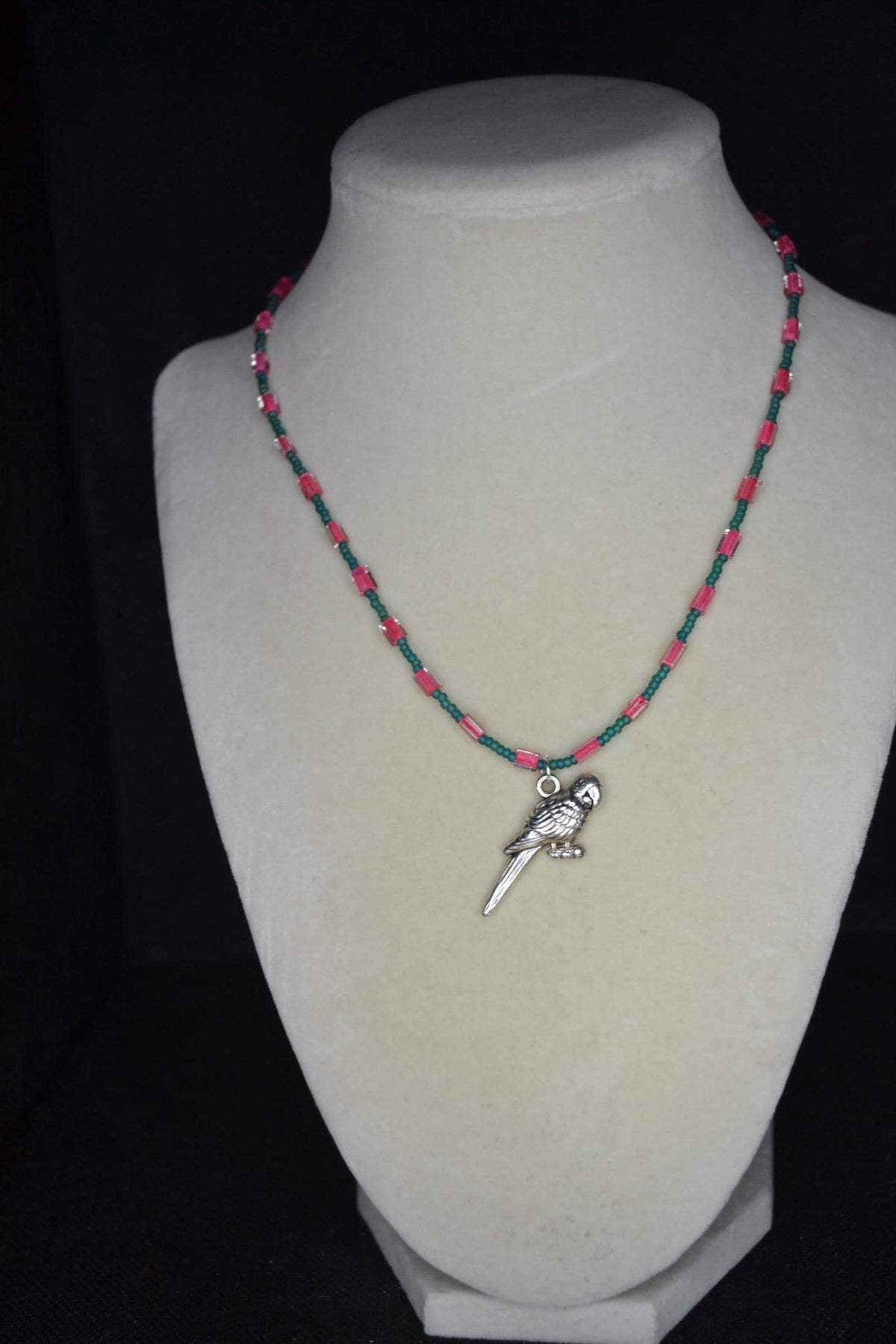 Silver Parrot pendant glass bead necklace. Teal and fuchsia
