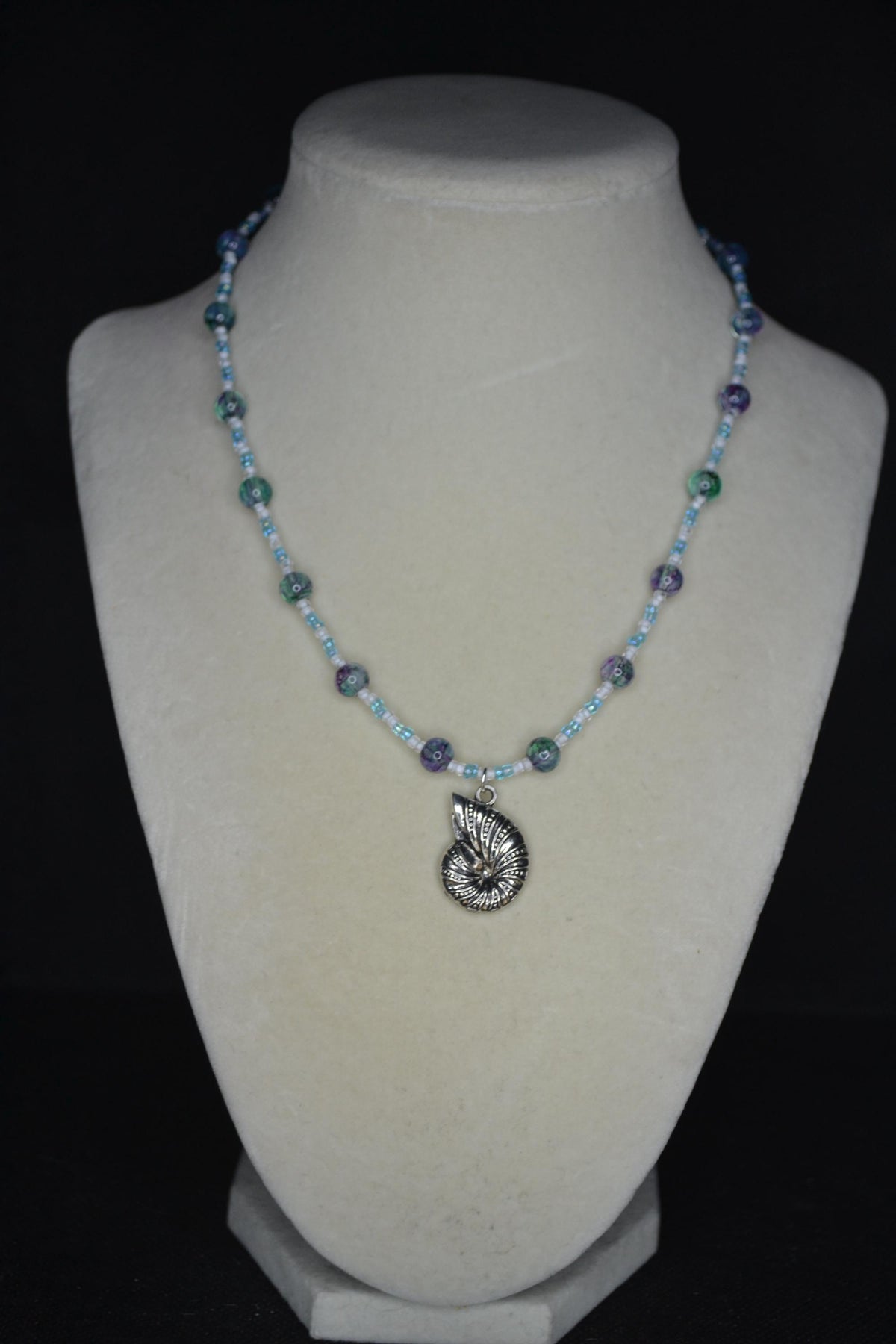 Silver Snail Shell pendant glass bead necklace. Blues and white