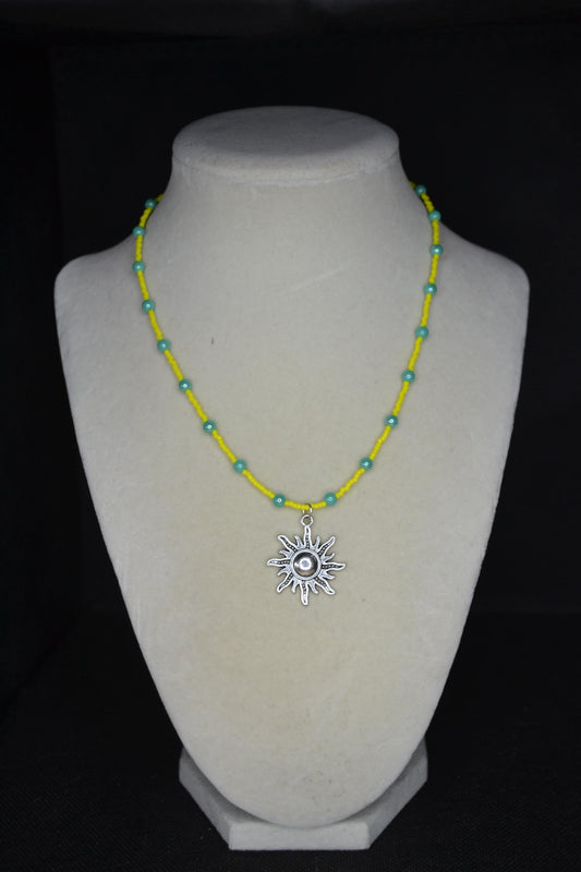 Silver sun pendant glass bead necklace. Yellow and turquoise