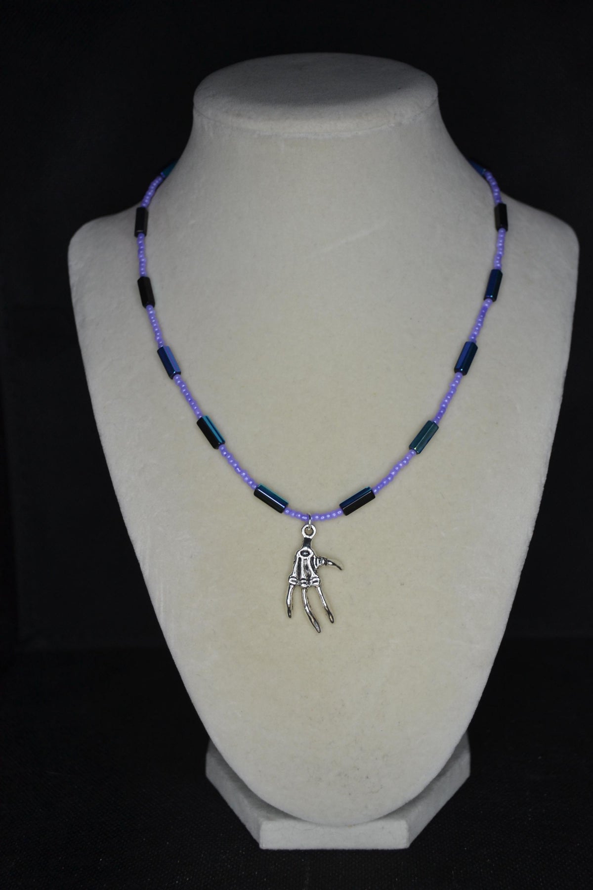 Silver talon skeleton pendant glass bead necklace. Lavender and metallic black