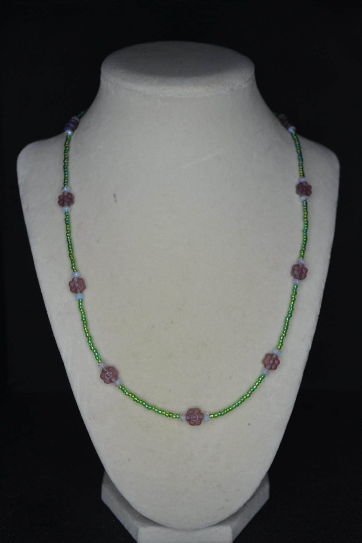 Beaded flower glass necklace. Iridescent purple, green, and sky blue. Reversible