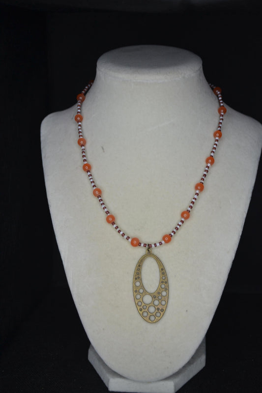 Brass bubbles pendant glass bead necklace. Orange, white, and brown