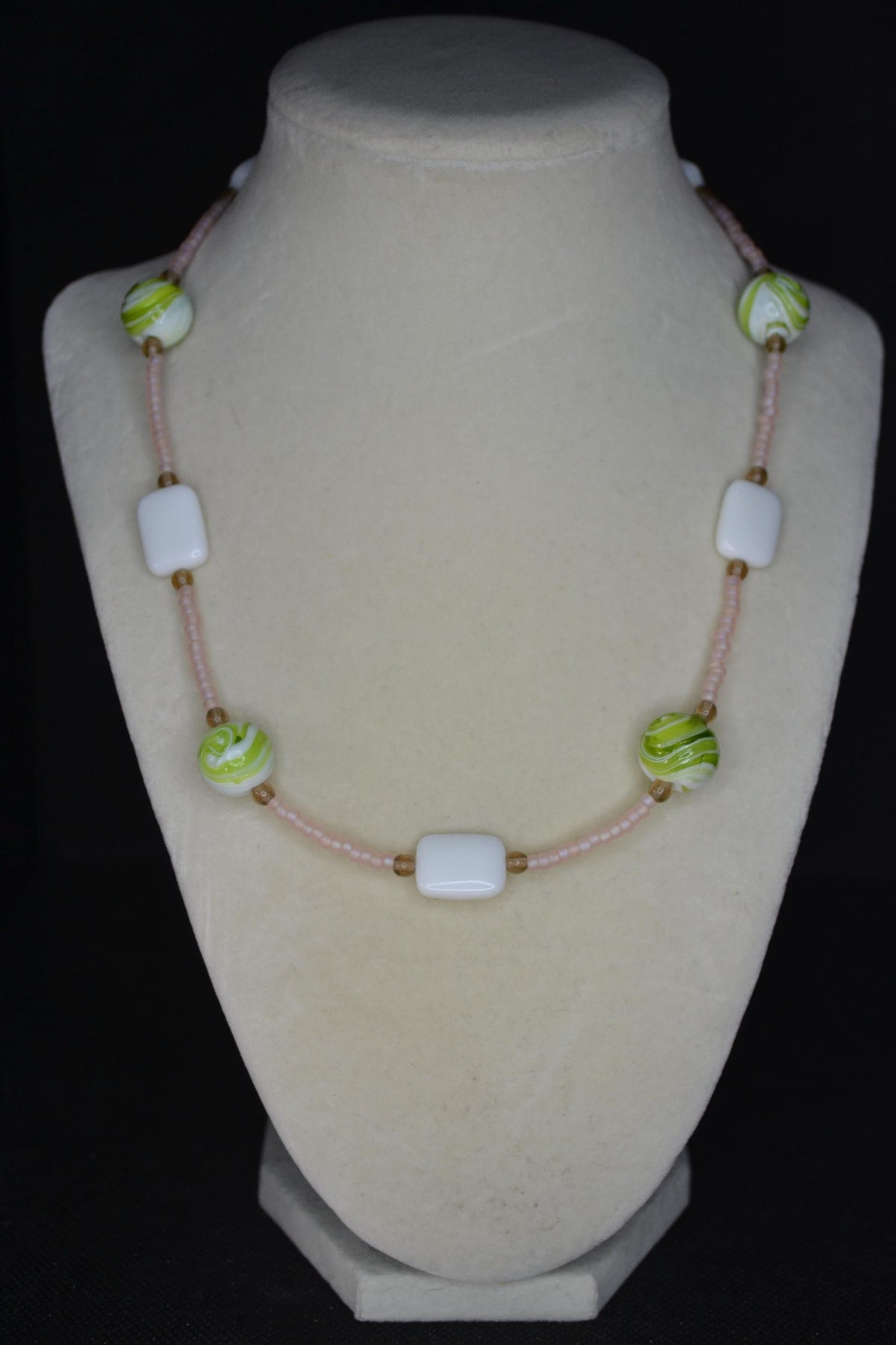 Multicolor glass bead necklace. Frosted rose, green swirls, and white tiles.