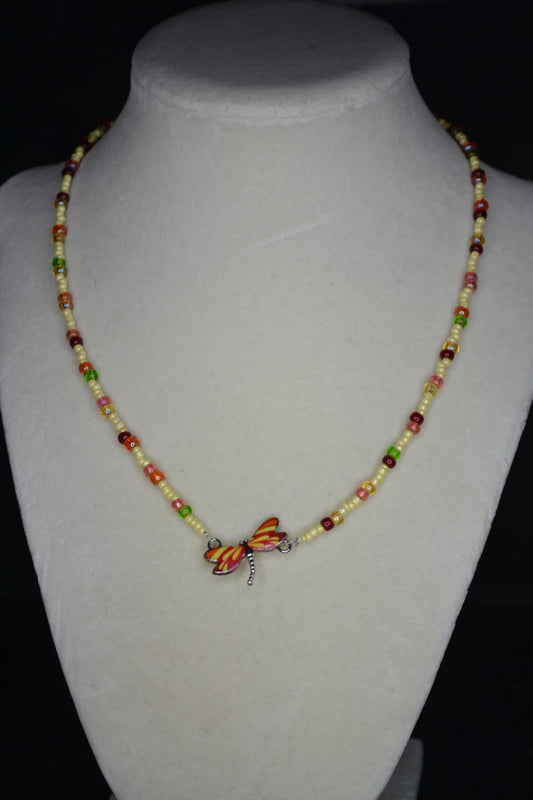Red and Yellow Dragonfly pendant glass bead necklace. Butter yellow and rainbow