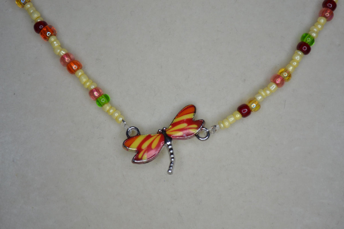 Red and Yellow Dragonfly pendant glass bead necklace. Butter yellow and rainbow