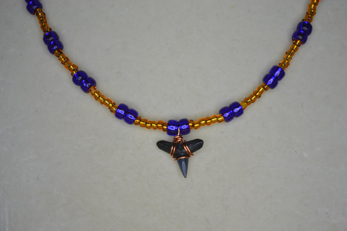 Wire wrapped sharks tooth beaded necklace. Brown and indigo