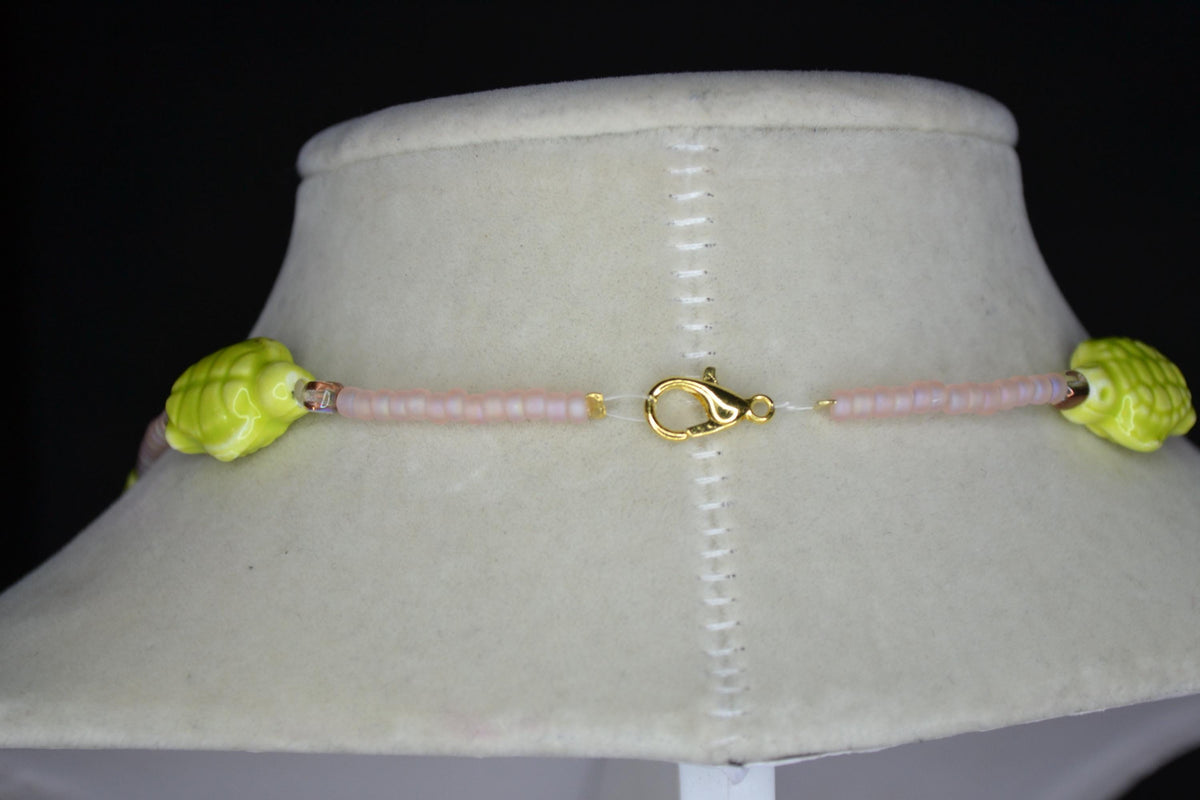 Beaded Sea Turtle necklace. Frosted pink, amber, and green