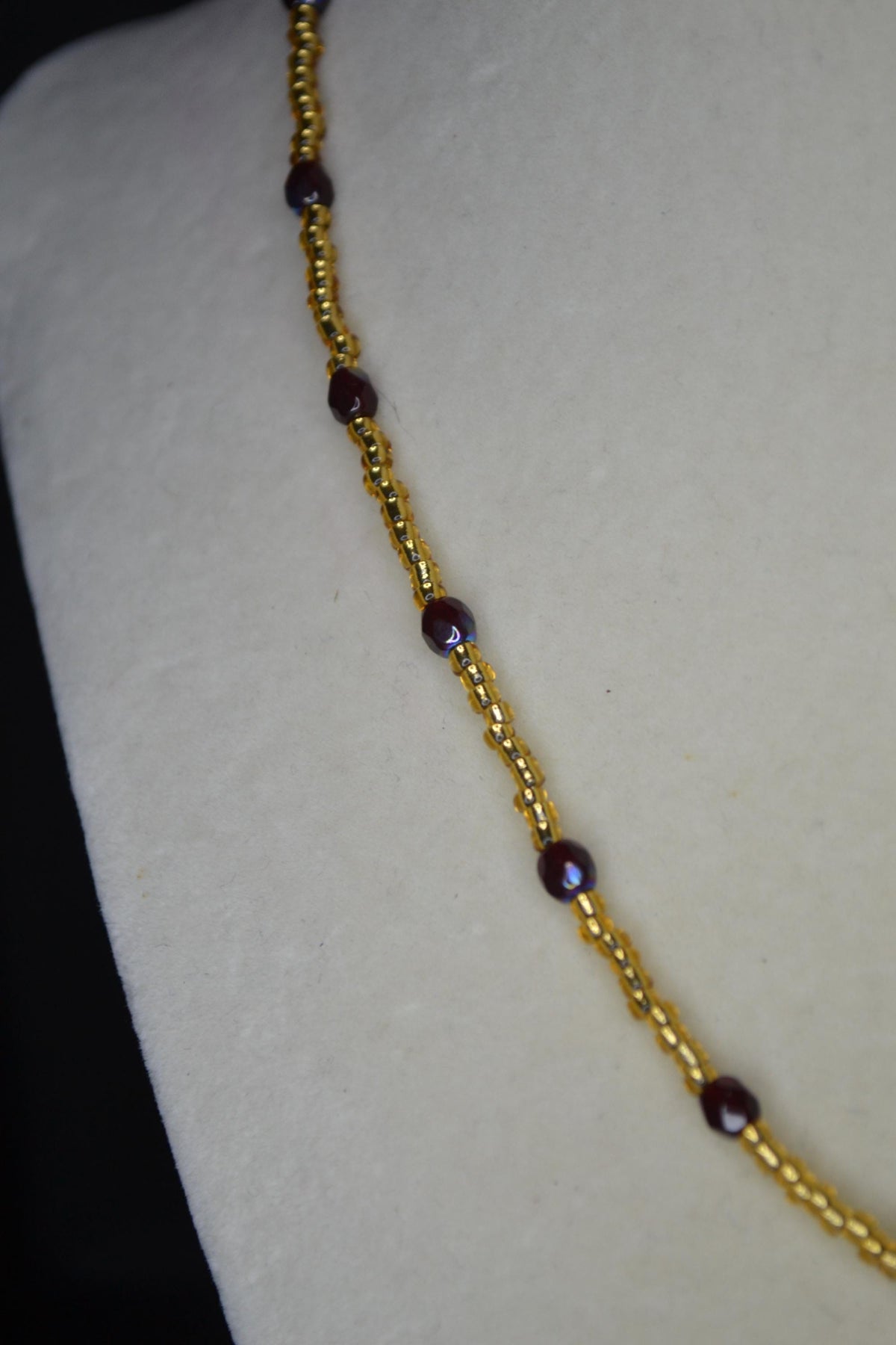 Gold feather pendant glass bead necklace. Garnet and gold. FSU