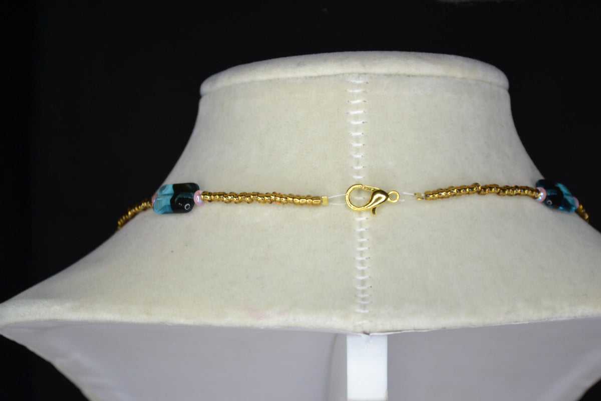 Multicolor glass bead necklace. Blue tortoise, brown, and iridescent pink