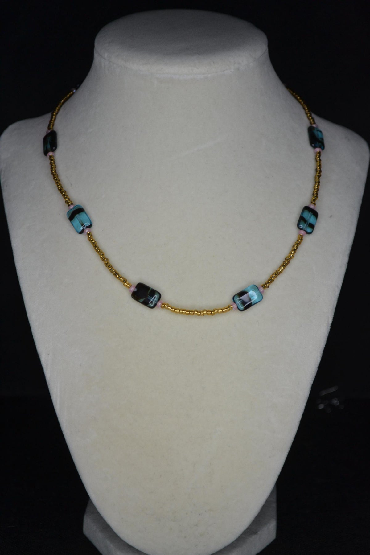 Multicolor glass bead necklace. Blue tortoise, brown, and iridescent pink
