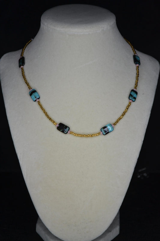 Multicolor glass bead necklace. Blue tortoise, brown, and iridescent pink