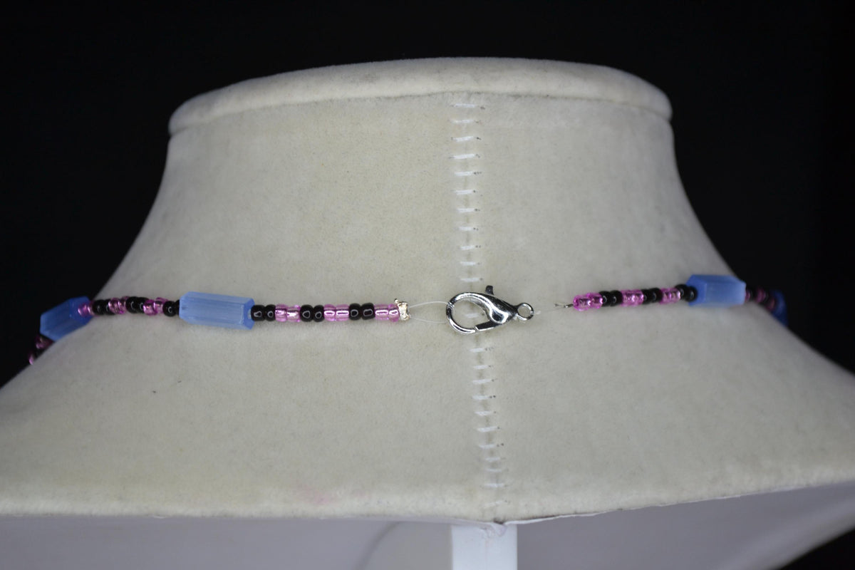 Multicolor glass bead necklace. Blue cat eye, pink, and black