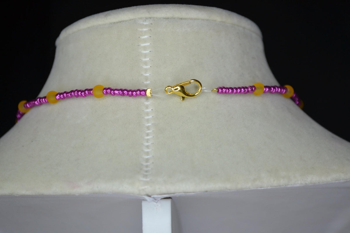 Gold flower pendant glass bead choker. Metallic pink and frosted orange