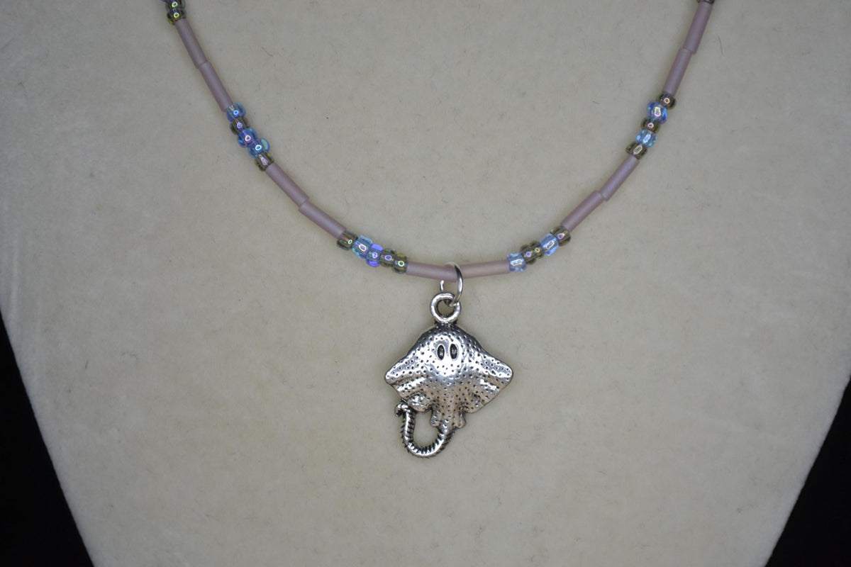 Silver Stingray pendant glass bead necklace. Blues and frosted rose