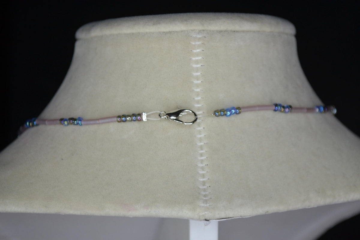 Silver Stingray pendant glass bead necklace. Blues and frosted rose