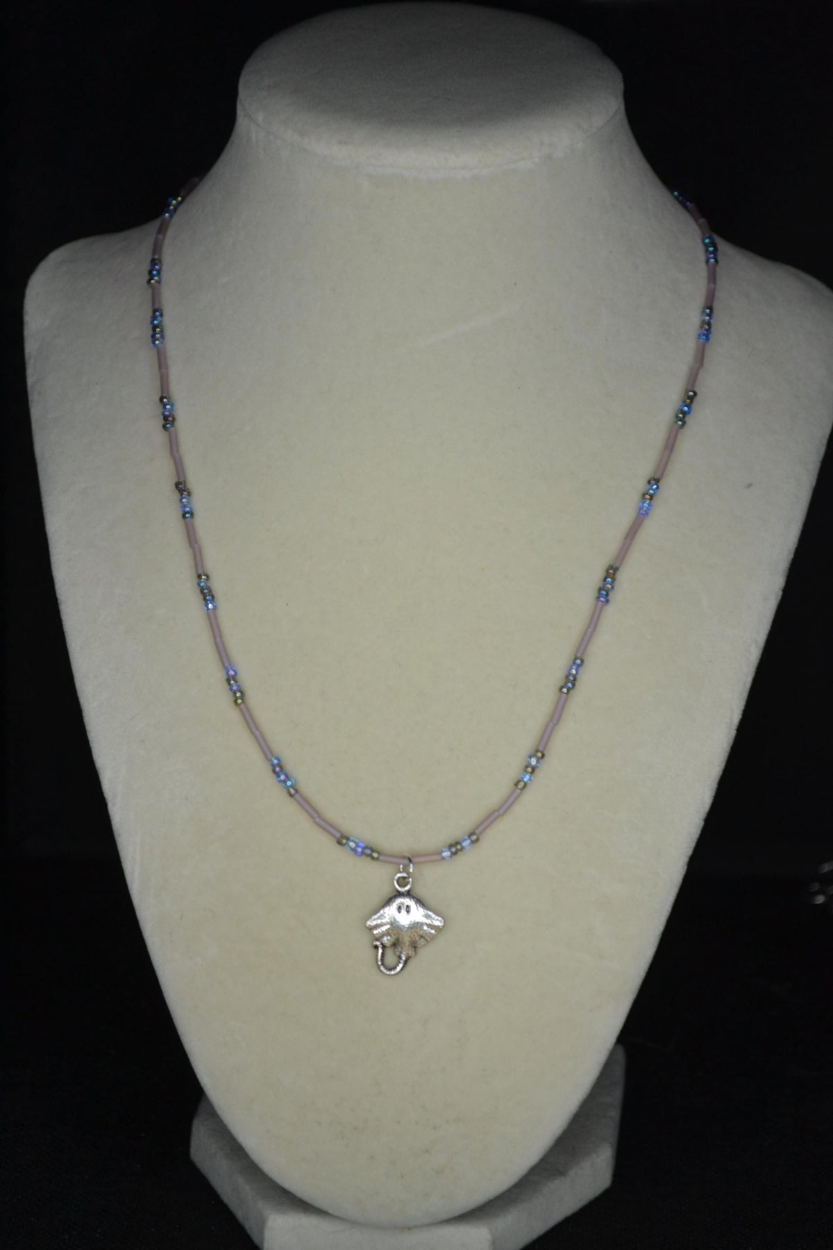 Silver Stingray pendant glass bead necklace. Blues and frosted rose