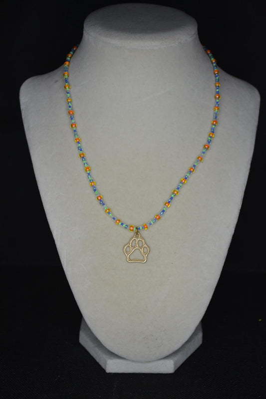 Gold Paw print pendant glass bead necklace. Orange, green, and blue