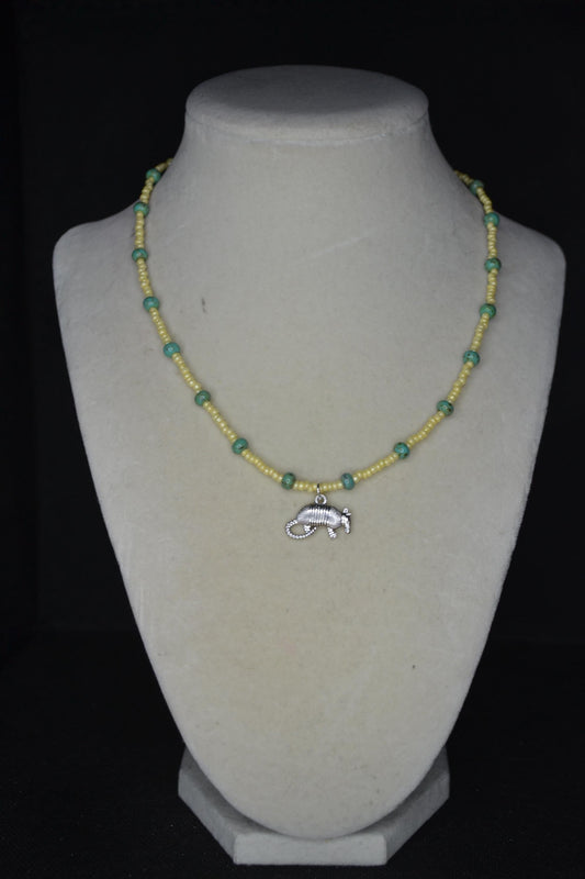 Silver Armadillo pendant glass bead necklace. Yellow and turquoise