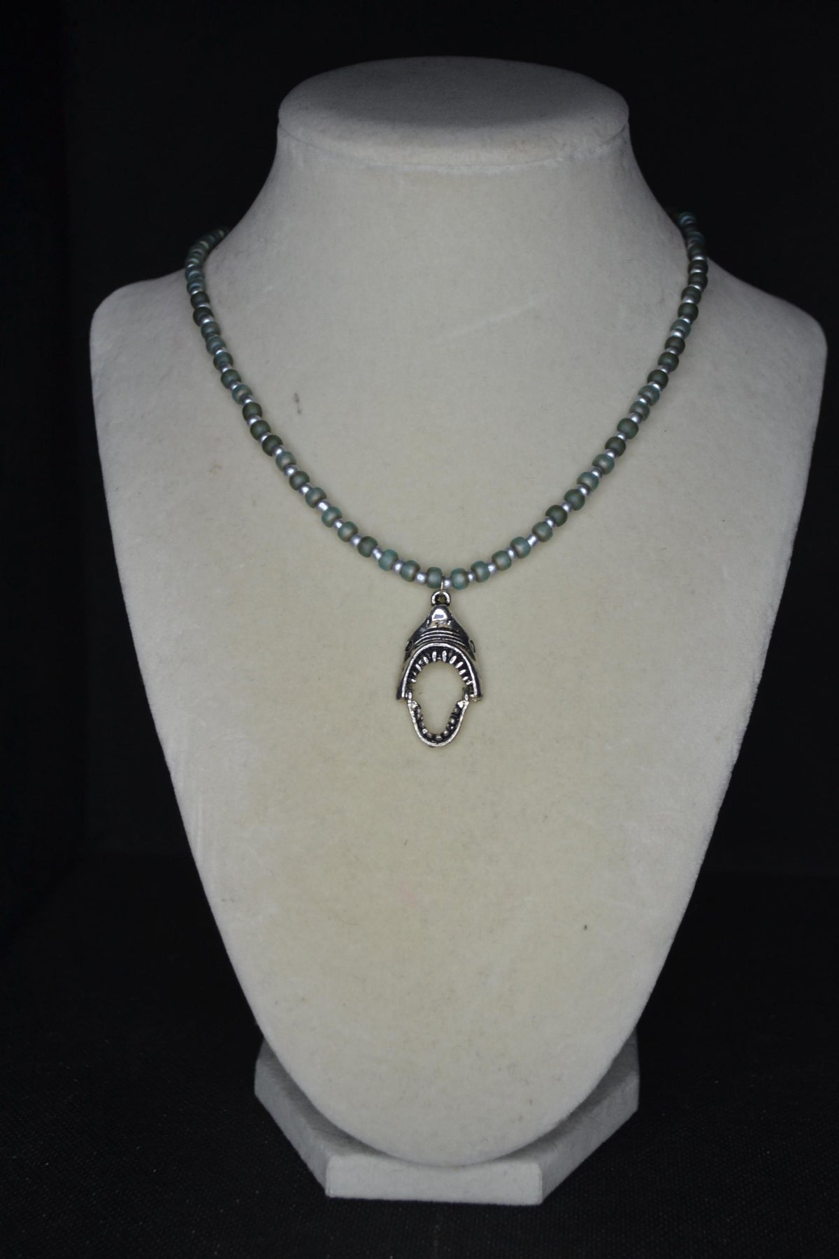 Silver Shark jaws pendant glass bead necklace. Frosted blue & silver