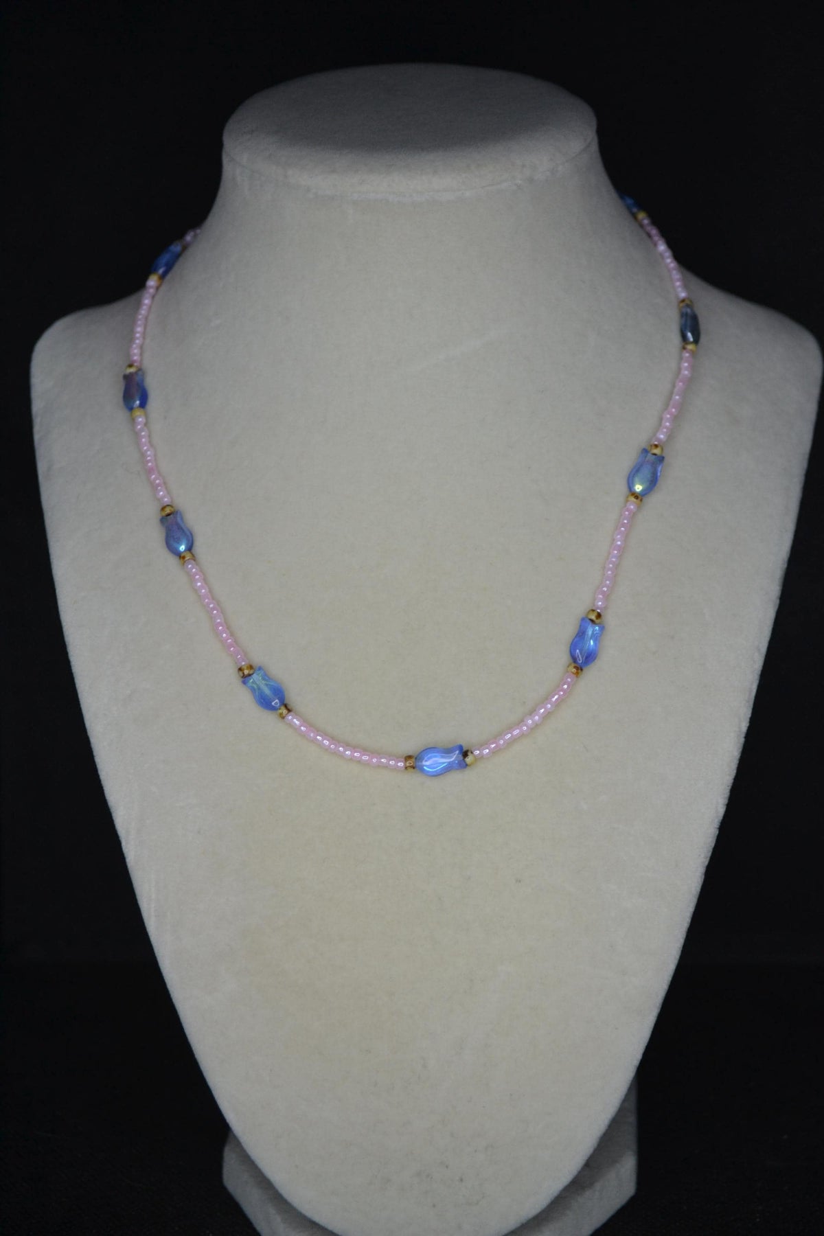 Beaded fish necklace. Pearl pink, iridescent blue, and Picasso