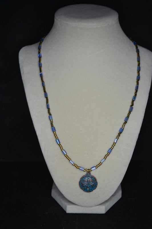 Bronze Sand dollar pendant glass bead necklace. Blue and bronze