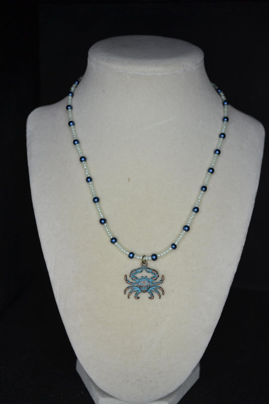 Bronze& Blue Crab pendant glass bead necklace. Pearl green and navy