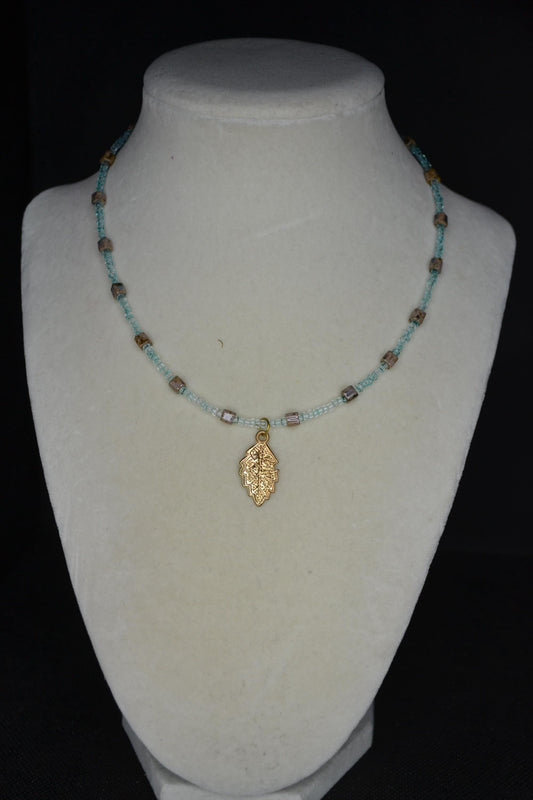 Feather pendant glass bead necklace. Teal and natural stone