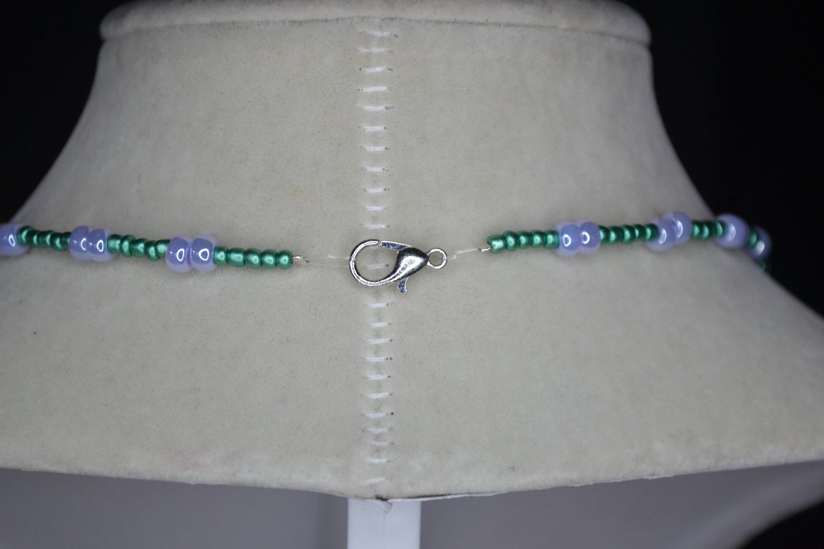 Silver marijuana pendant glass bead necklace. Metallic green and pearlescent lavender