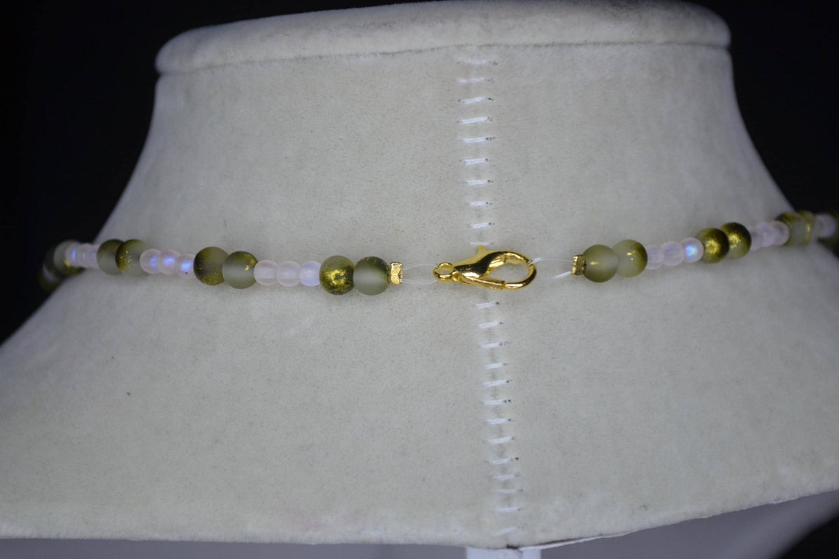 Bronze butterfly pendant glass bead necklace. Frosted pink and frosted green gold