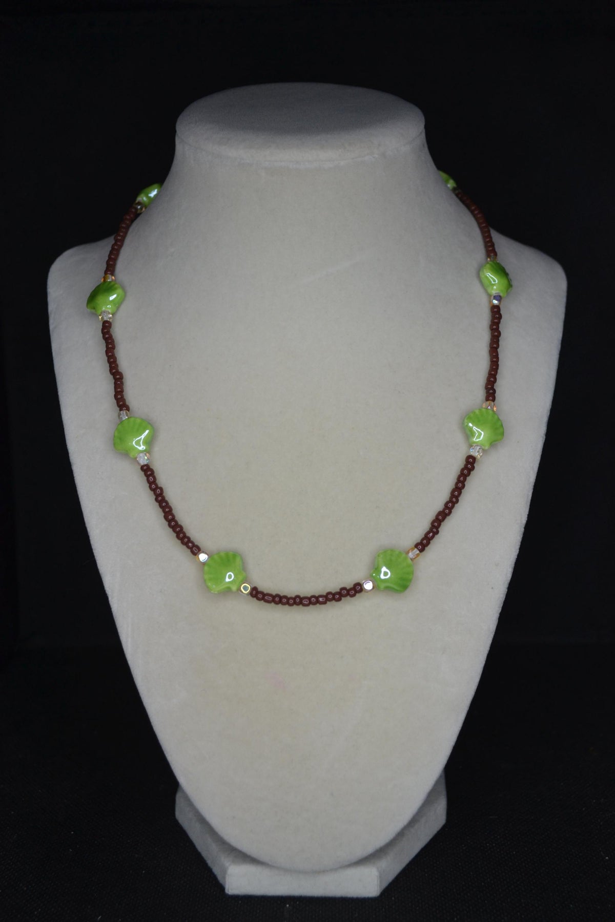 Beaded Seashell Necklace. Green, brown, and metallic amber