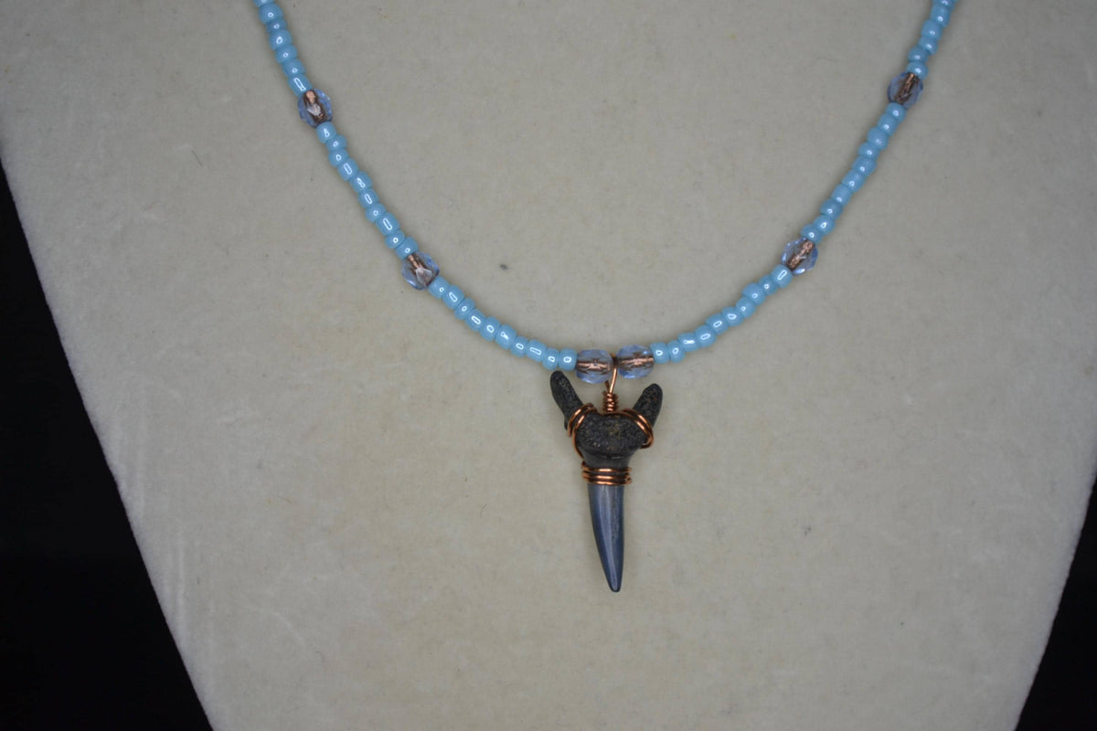 Wire wrapped sharks tooth beaded necklace. Silver and blue