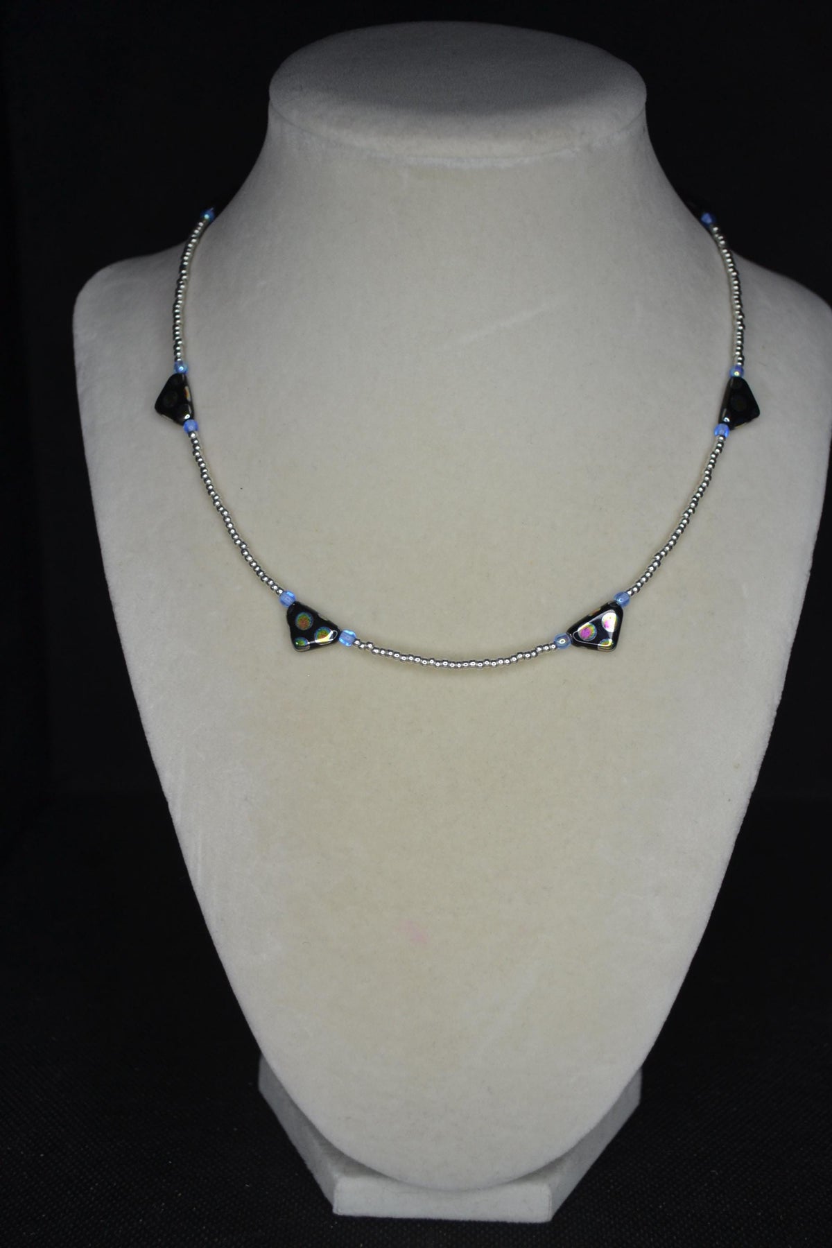 Black Peacock glass beaded necklace. Silver and blue