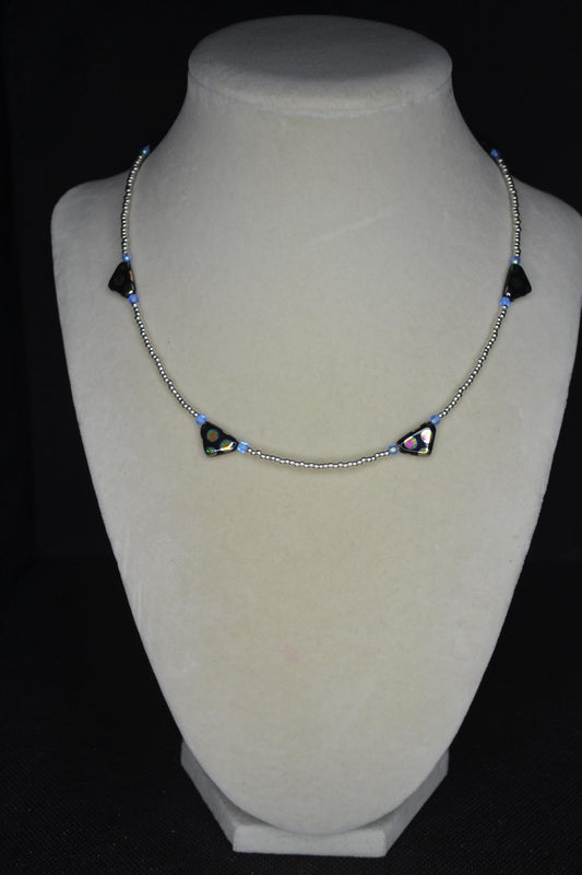 Black Peacock glass beaded necklace. Silver and blue