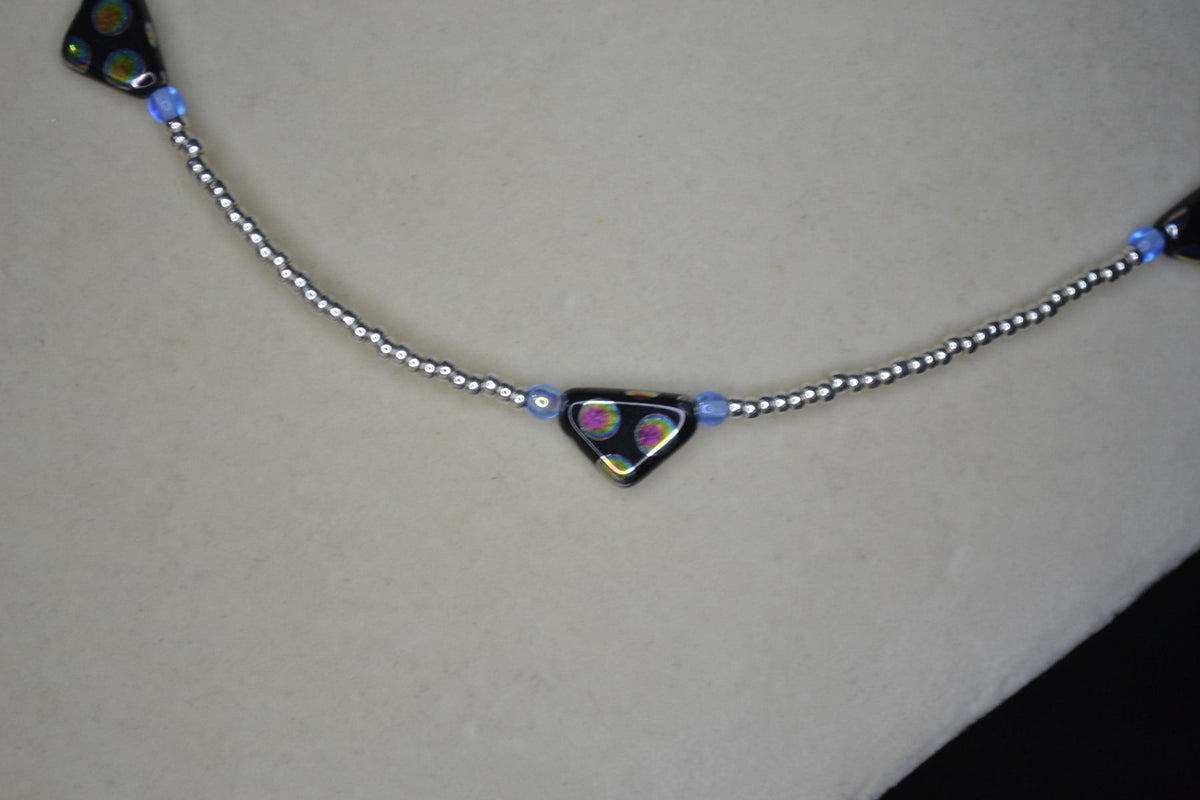Black Peacock glass beaded necklace. Silver and blue