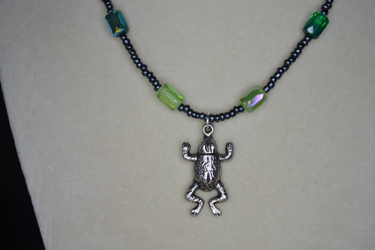 Silver Frog pendant glass bead necklace. Greens and metallic black