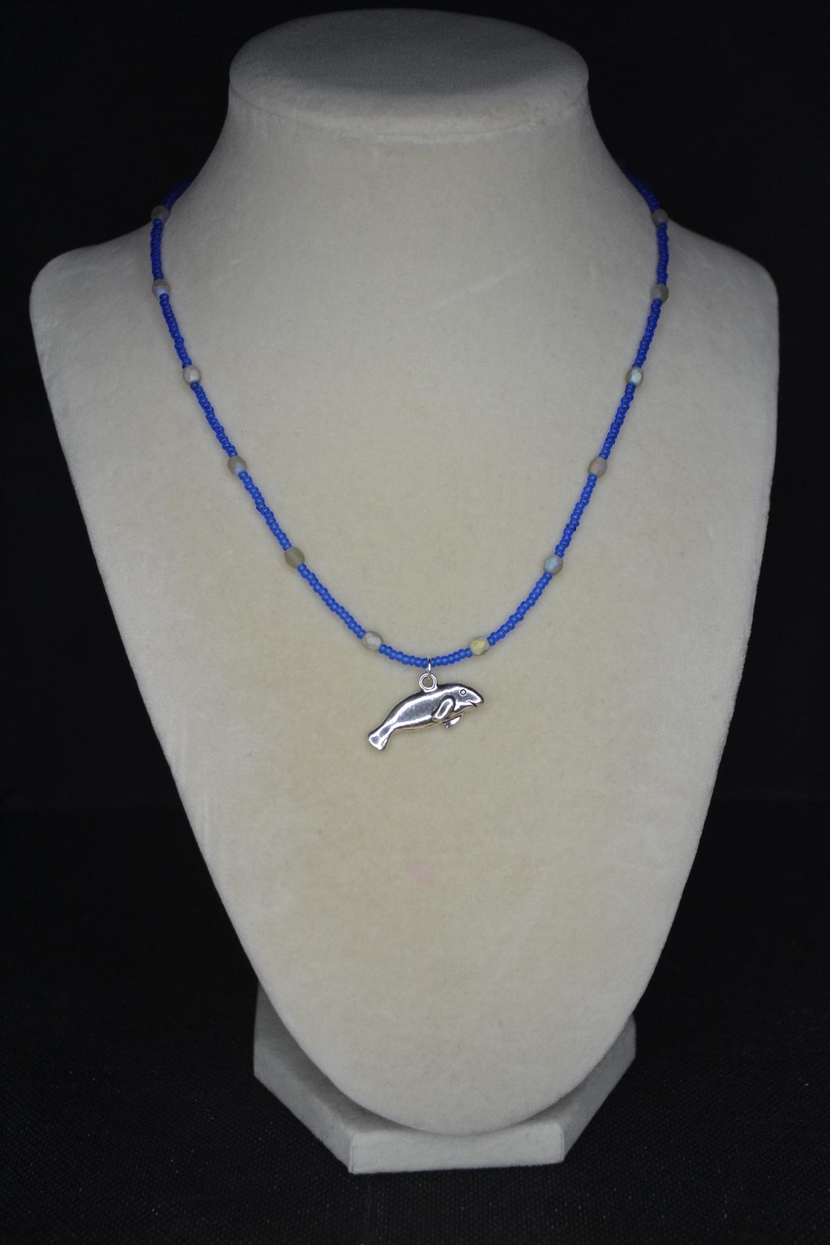 Silver Manatee pendant glass bead necklace. Cobalt and iridescent sea glass