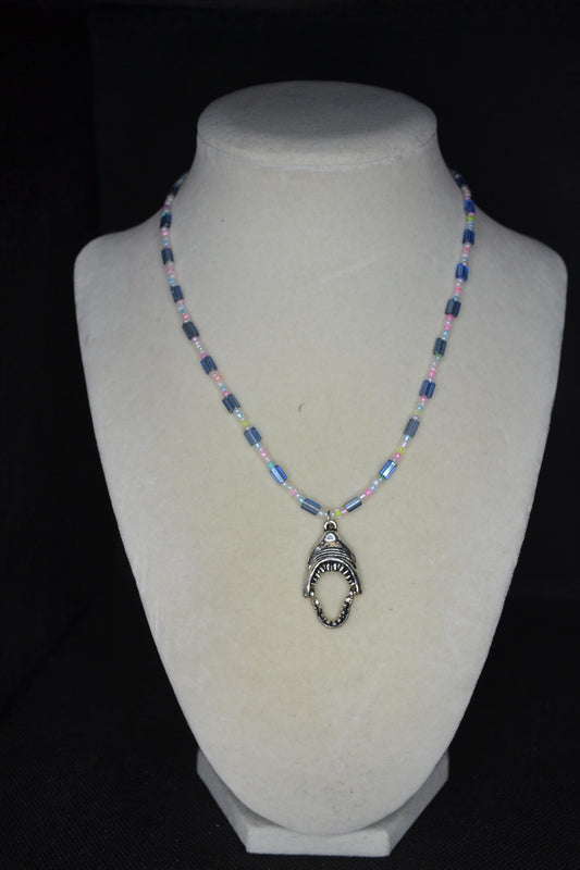 Silver Jaws head pendant glass bead necklace. Blue and pastels
