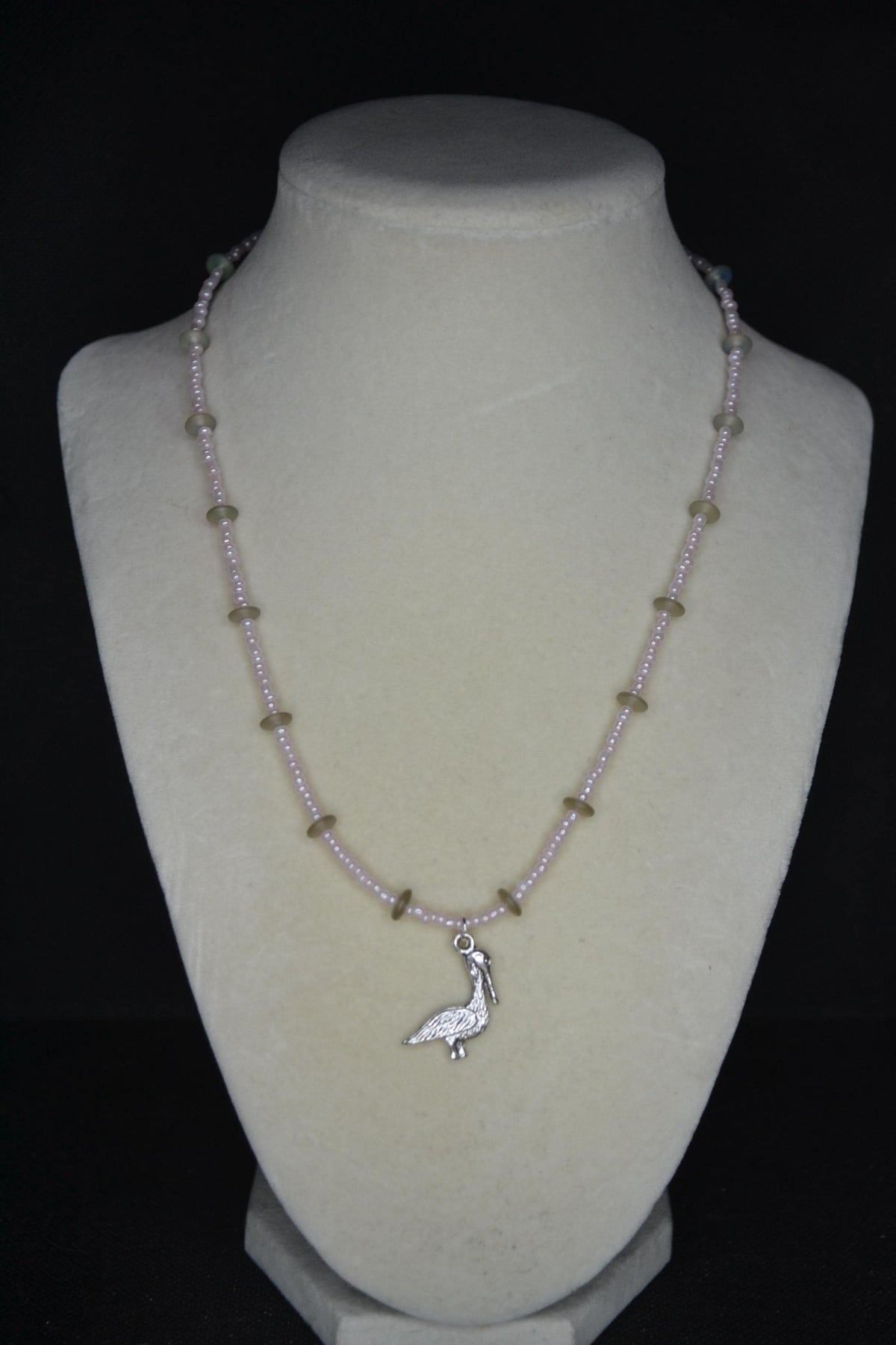 Silver Pelican pendant glass bead necklace. Pearl pink and sea glass